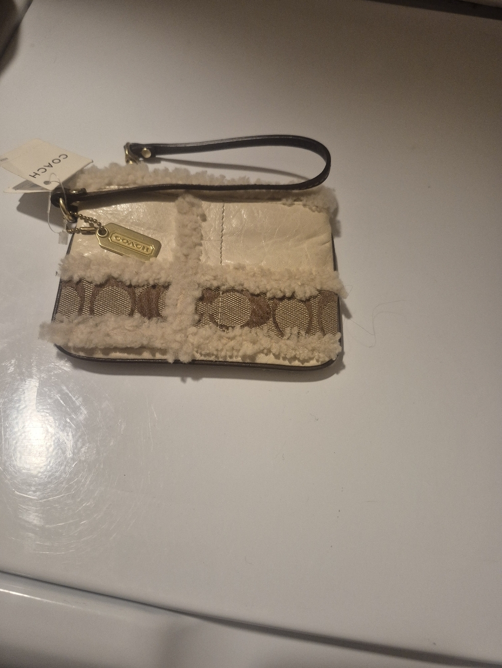 Coach Cream Shearling Wristlet